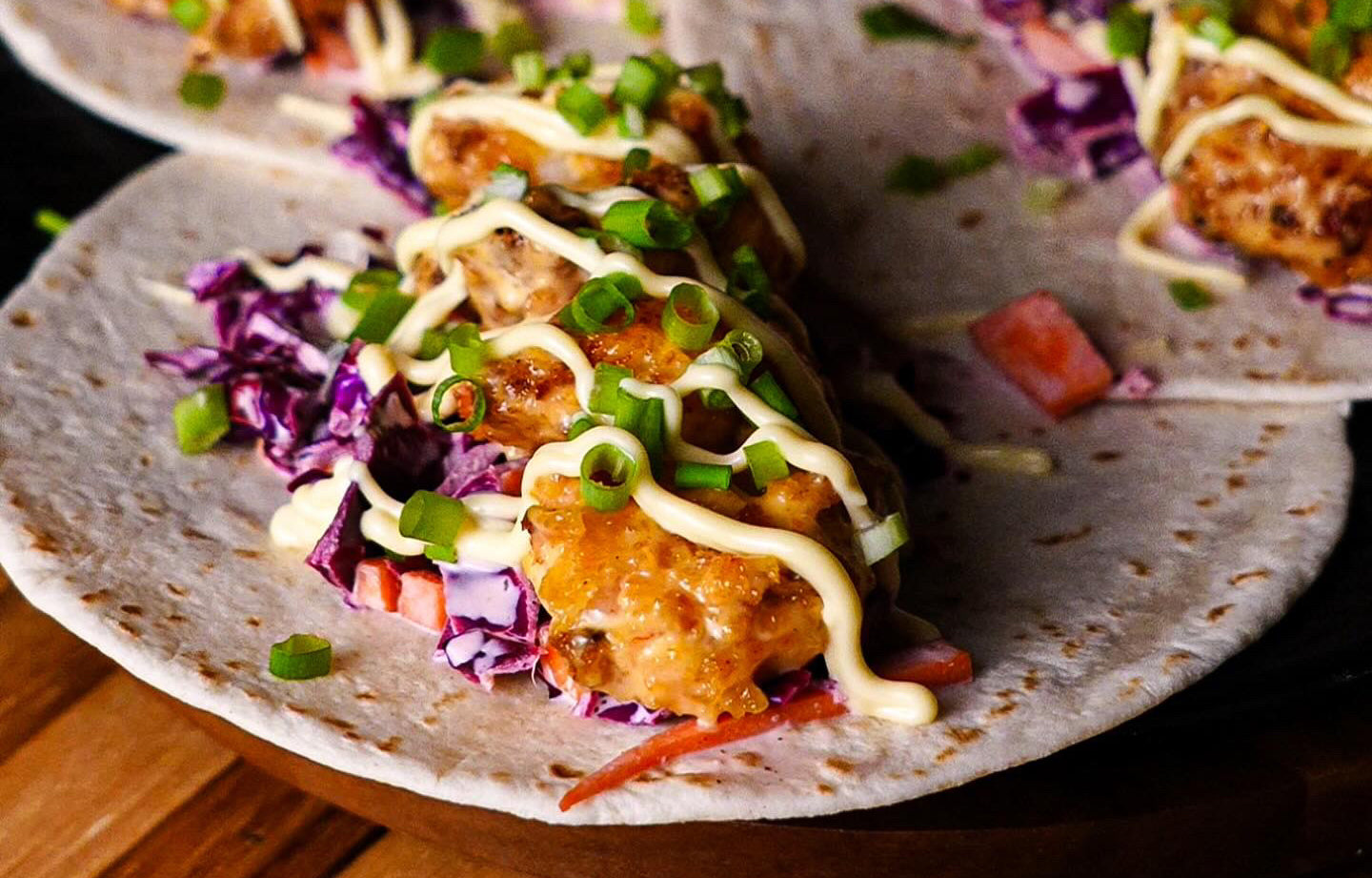 Bang Bang Shrimp Tacos on Highland cutting board