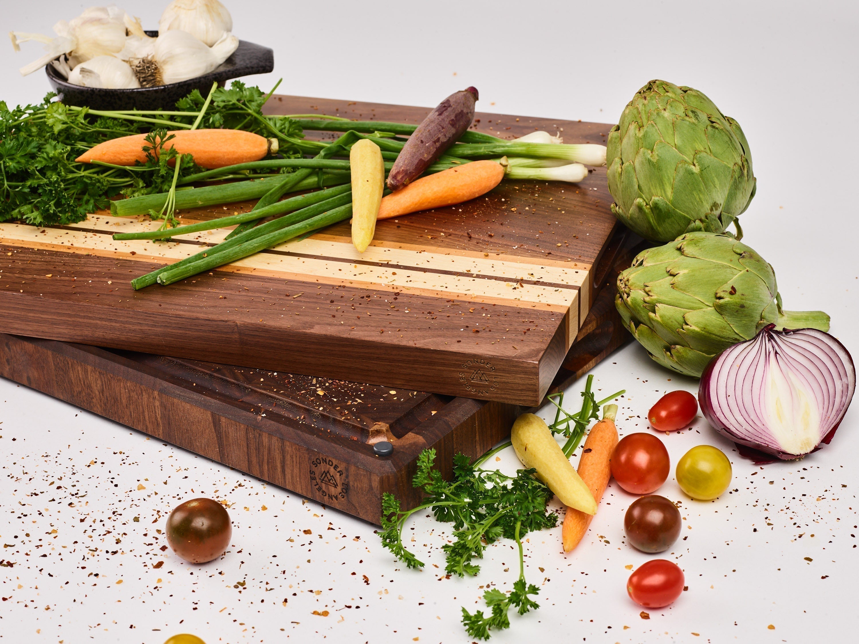 End grain vs. edge grain wood cutting boards side by side on a kitchen counter