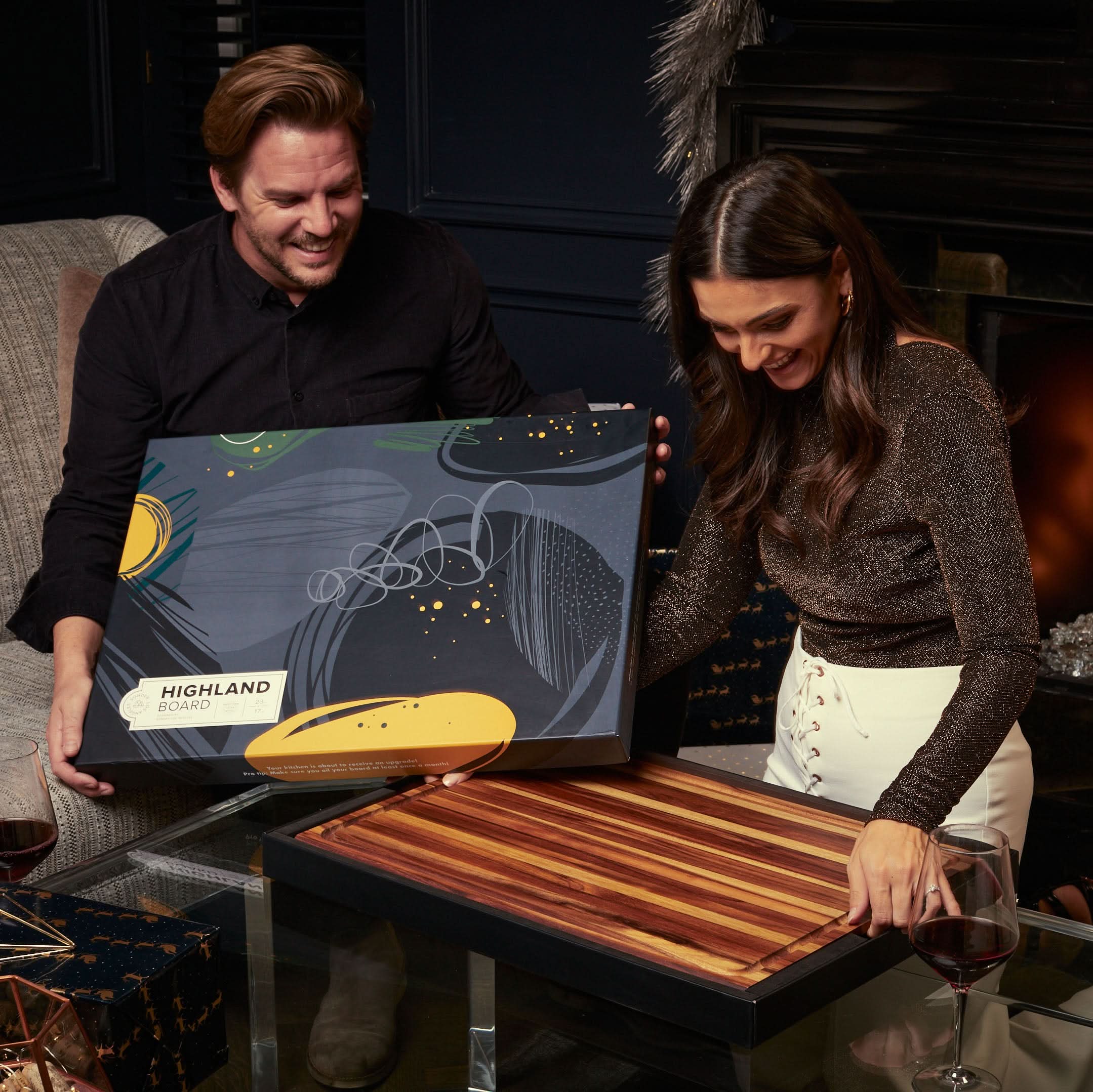 Couple opening Sonder LA Highland Extra Large Teak Wood Cutting Board Gift Box