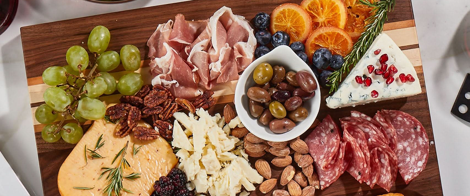A Sonder LA charcuterie board with various meat, cheese and fruits