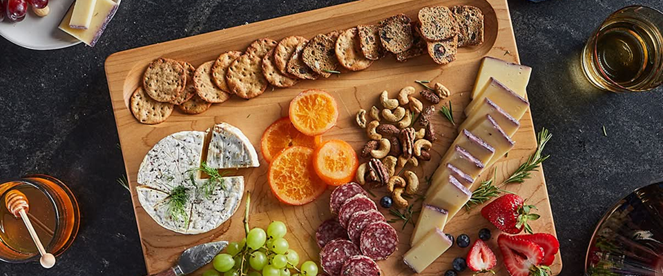 Charcuterie on a Sonder LA Charcuterie board showing off the cracker well feature